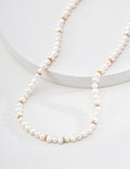 Minimalist Gold Rondelle Pearl Necklace - Draped on Steps