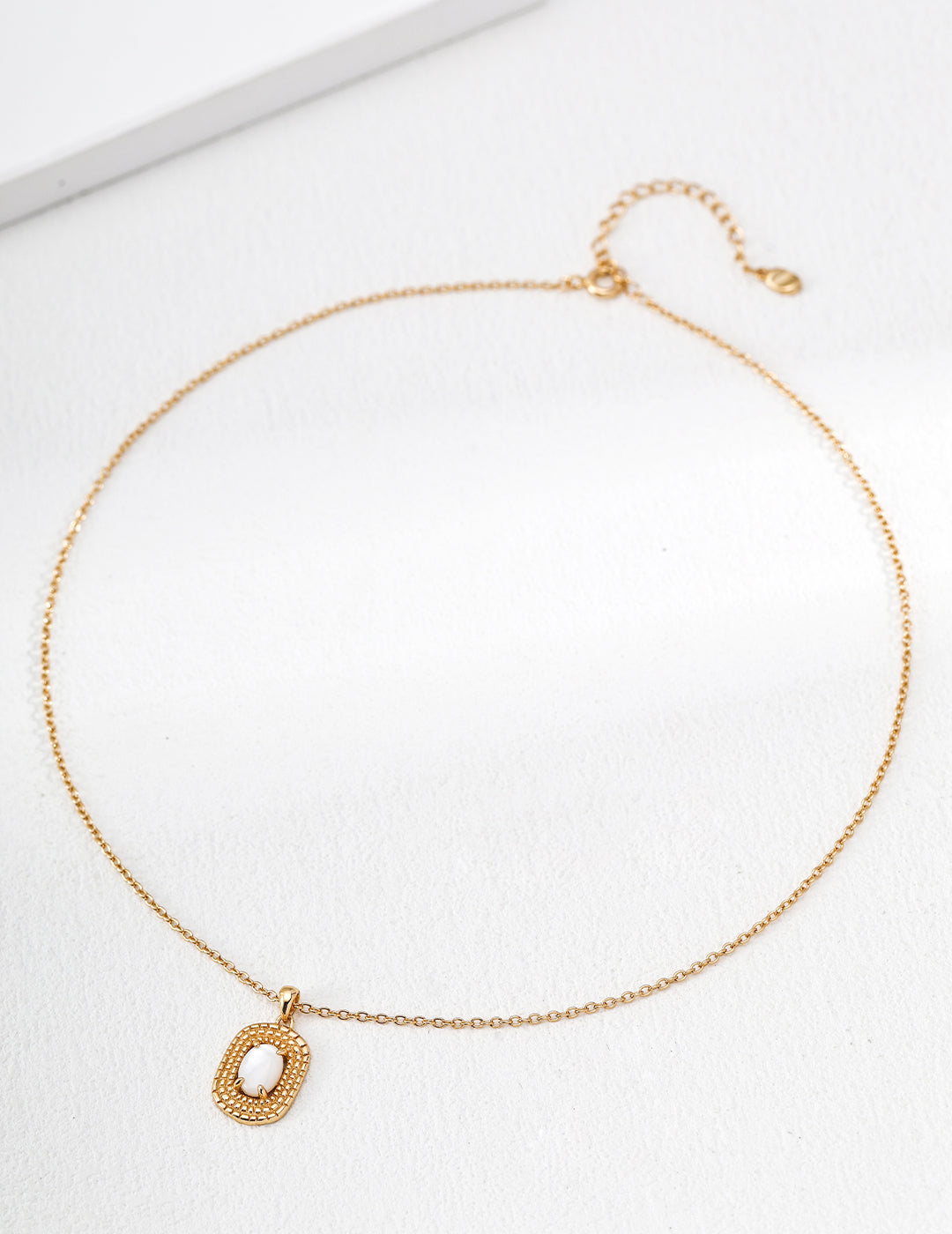 "Woven Rattan" Mother-of-Pearl Medallion Necklace - Pearl Flat Lay